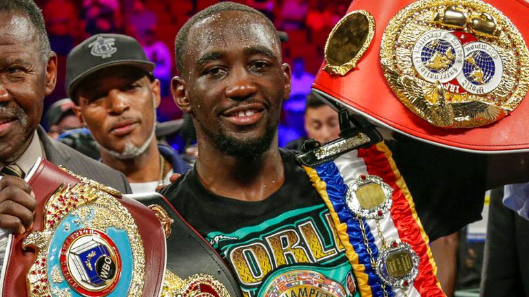 Terence "Bud" Crawford poses woth his four title belts after winning by knockout against Julius Indongo in the third round of a junior welterweight world title unification bout in Lincoln, Neb., Saturday, Aug. 19, 2017. Undefeated Crawford now holds the WBO, WBC, IBF and WBA 140 pound world titles. It was only the second fight in the four-belt era in which all four titles were on the line. (AP Photo/Nati Harnik)