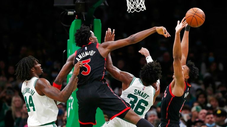 Toronto Raptors&#39; OG Anunoby (3) blocks a shot by Boston Celtics&#39; Marcus Smart (36) during the second half of an NBA basketball game, Wednesday, Nov. 10, 2021, in Boston. (AP Photo/Michael Dwyer)