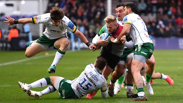 Harlequins' Tyrone Green tackled by London Irish's Curtis Rona during the Gallagher Premiership match at Twickenham Stoop, London. Picture date: Saturday November 27, 2021. See PA story RUGBYU Harlequins. Photo credit should read: Ashley Western/PA Wire. RESTRICTIONS: Use subject to restrictions. Editorial use only, no commercial use without prior consent from rights holder.