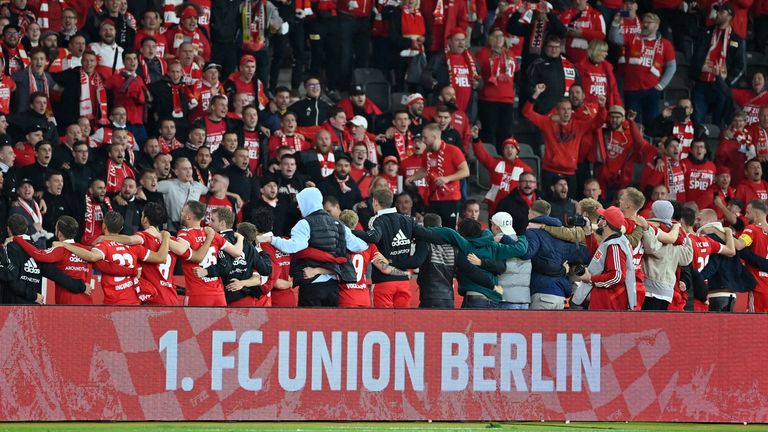 Union Berlin players celebrate with the fans at the Stadion An der Alten Försterei