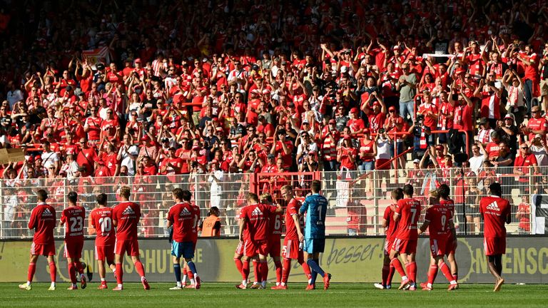 Union Berlin fans celebrate with the players