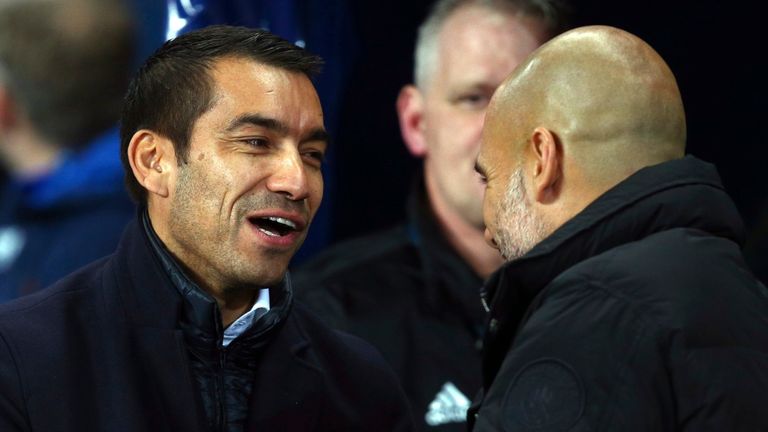 Feyenoord coach Giovanni Van Bronckhorst, left, shakes hands with Manchester City coach Josep Guardiola prior to the start of the Champions League group F soccer match between Manchester City and Feyenoord, at the Etihad Stadium in Manchester, England, Tuesday, Nov. 21, 2017. (AP Photo/Dave Thompson)