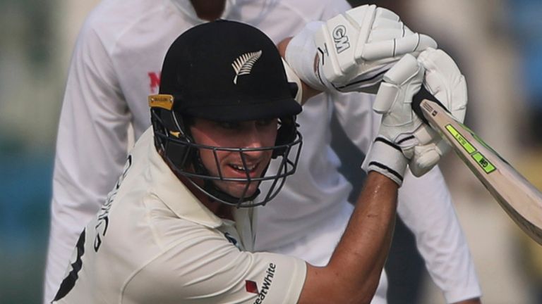 New Zealand's Will Young plays a cover drive during the day two of their first test cricket match with India in Kanpur, India, Friday, Nov. 26, 2021.  Associated Press
