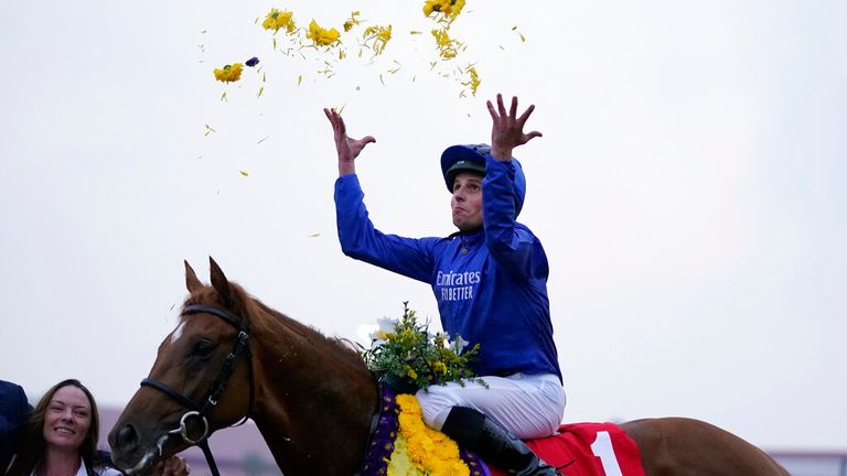 William Buick celebrates on board Modern Games after victory in the Juvenile Turf at Del Mar