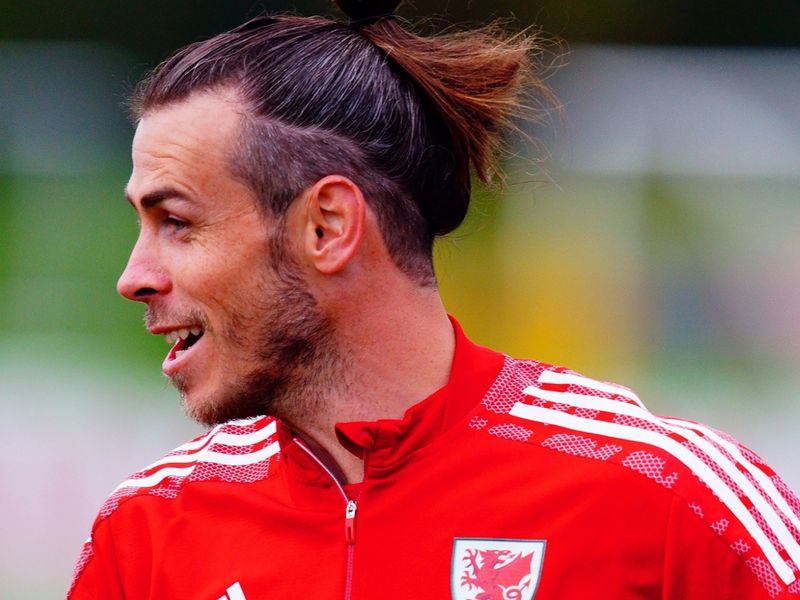 Gareth Bale's hair falls out of his man bun during Wales' draw