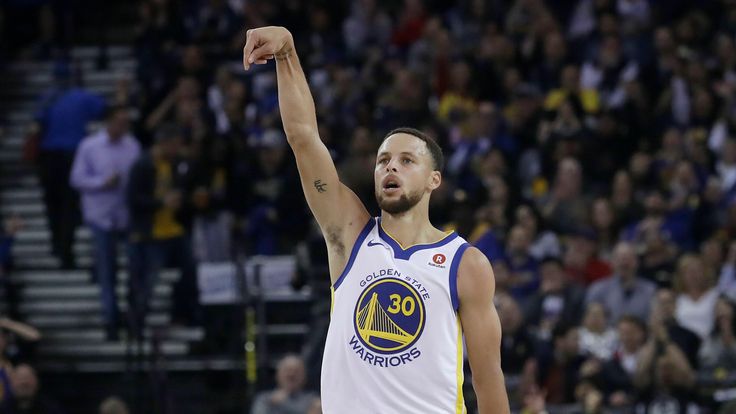 Golden State Warriors guard Stephen Curry reacts after scoring against the Brooklyn Nets in 2018