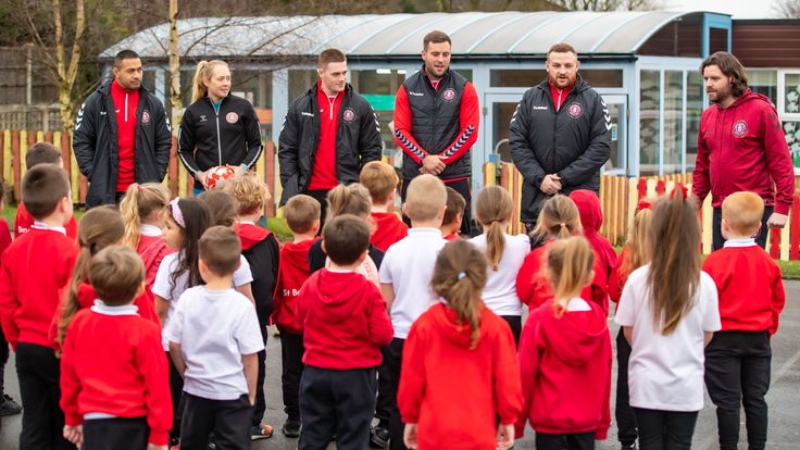 Wigan players Willie Isa, Anna Mary Davies, Sam Halsall, Iain Thornley and Brad Singleton speak to children at St Benedict's Primary School