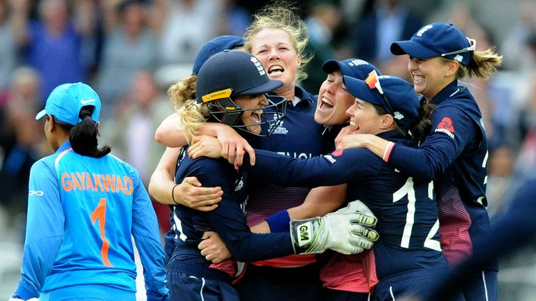 England's players mob Anya Shrubsole following their win over India in the previous World Cup final