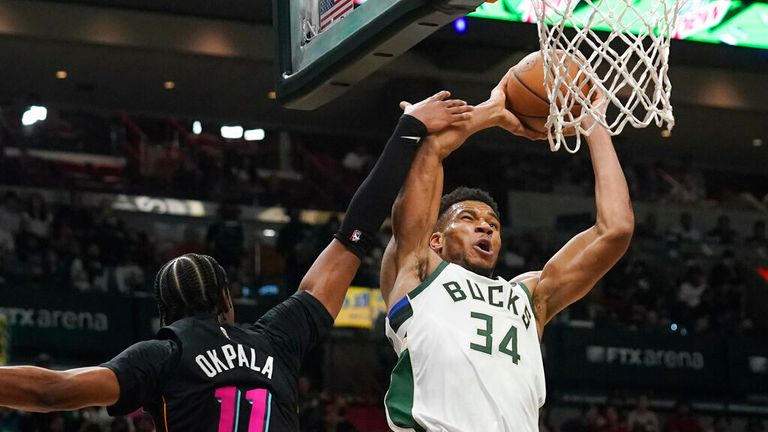 Milwaukee Bucks forward Giannis Antetokounmpo (34) drives to the basket as Miami Heat forward KZ Okpala (11) defends during the second half of an NBA basketball game, Wednesday, Dec. 8, 2021, in Miami. The Heat defeated the Bucks 113-104. (AP Photo/Marta Lavandier)