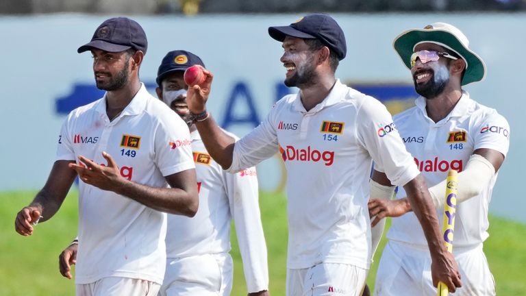 Sri Lankan cricketers from left to right Lasith Embuldeniya, Charith Asalanka, Ramesh Mendis and Chamika Karunaratne celebrate their 164 runs victory over West Indies in the second Test match in Galle, Sri Lanka, Friday, Dec. 3, 2021. (AP Photo/Eranga Jayawardena)