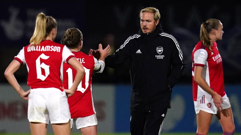 Arsenal head coach Jonas Eidevall greets Kim Little
