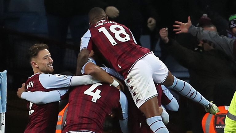 Aston Villa celebrate Ezri Konsa's second