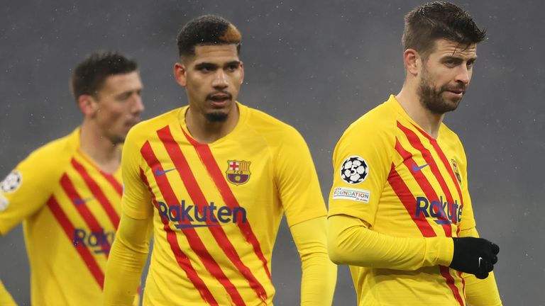 Barcelona players look dejected after being knocked out of the Champions League at the group stage