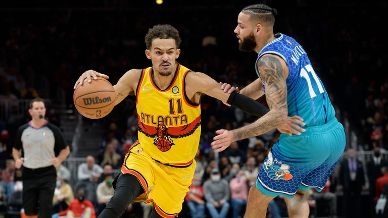 Atlanta&#39;s Trae Young provided the splendid assist as John Collins slammed home against Charlotte in the second half.