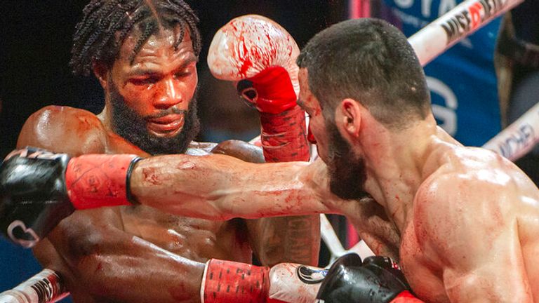 Artur Beterbiev, right, battles Marcus Browne during their WBC/IBF light-heavyweight title fight in Montreal on Friday, December 17, 2021.THE CANADIAN PRESS/Peter McCabe