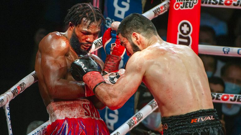 Artur Petterbiev, right, fights Marcus Brown during their fight for the WBC/IBF heavyweight title in Montreal on Friday, December 17, 2021.