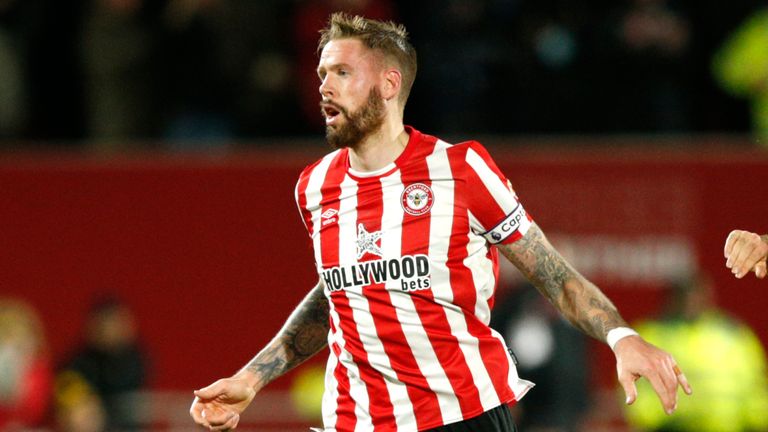 Brentford's Pontus Jansson, left, celebrates after scoring his side's opening goal during the English Premier League soccer match between Brentford and Watford, at Brentford Community Stadium, in London, Friday, Dec. 10, 2021. (AP Photo/David Cliff)