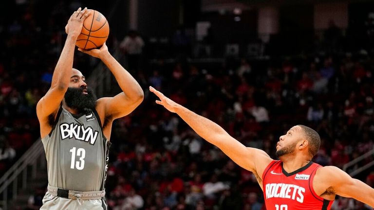 Brooklyn Nets guard James Harden (13) shoots a three point basket as Houston Rockets guard Eric Gordon defends during the first half of an NBA basketball game, Wednesday, Dec. 8, 2021, in Houston. (AP Photo/Eric Christian Smith)