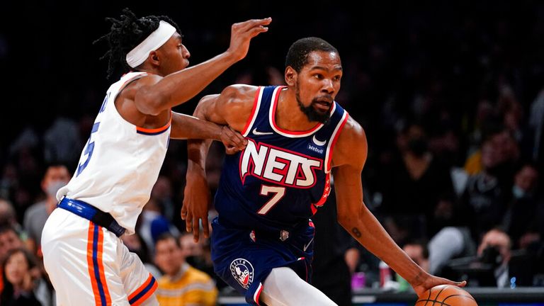 Brooklyn Nets forward Kevin Durant (7) drives against New York Knicks guard Immanuel Quickley (5) during the second half of an NBA basketball game, Tuesday, Nov. 30, 2021, in New York. The Nets won 112-110. (AP Photo/Mary Altaffer)