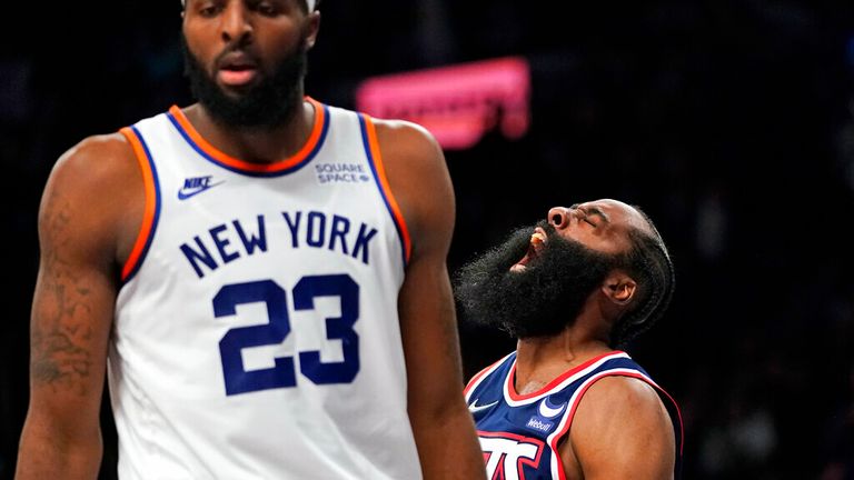 Brooklyn Nets guard James Harden and New York Knicks center Mitchell Robinson (23) react after Harden dunked during the second half of an NBA basketball game, Tuesday, Nov. 30, 2021, in New York. The Nets won 112-110. (AP Photo/Mary Altaffer)


