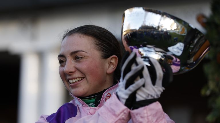 Bryony Frost holds aloft the Tingle Creek trophy at Sandown