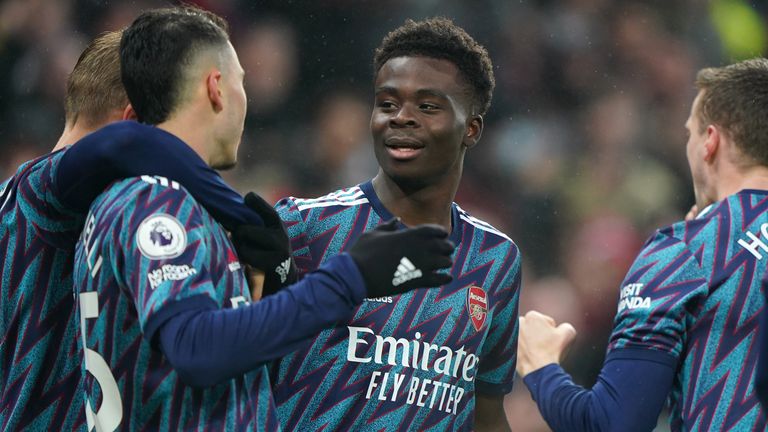 Bukayo Saka celebrates his goal with teammates