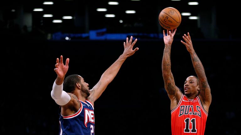 Chicago Bulls forward DeMar DeRozan (11) shoots over Brooklyn Nets center LaMarcus Aldridge (21) during the first half of an NBA basketball game in New York, Saturday, Dec. 4, 2021. (AP Photo/Noah K. Murray)


