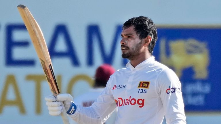 Sri Lanka's Dhananjaya de Silva raises his bat after completing a century against West Indies (Associated Press)