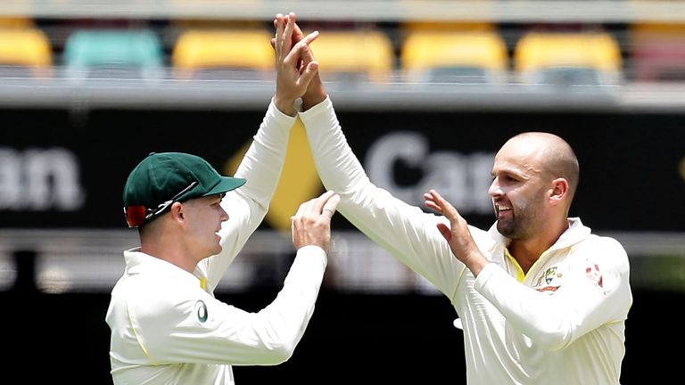  Australia's Nathan Lyon (R) celebrates an England wicket with Peter Handscomb during the 2017/18 Ashes Test at Brisbane (AP Photo/Tertius Pickard)
