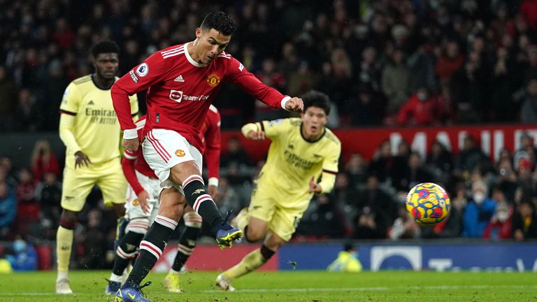 Cristiano Ronaldo scores the winning goal from the penalty spot during Manchester United's 3-2 victory over Arsenal at Old Trafford