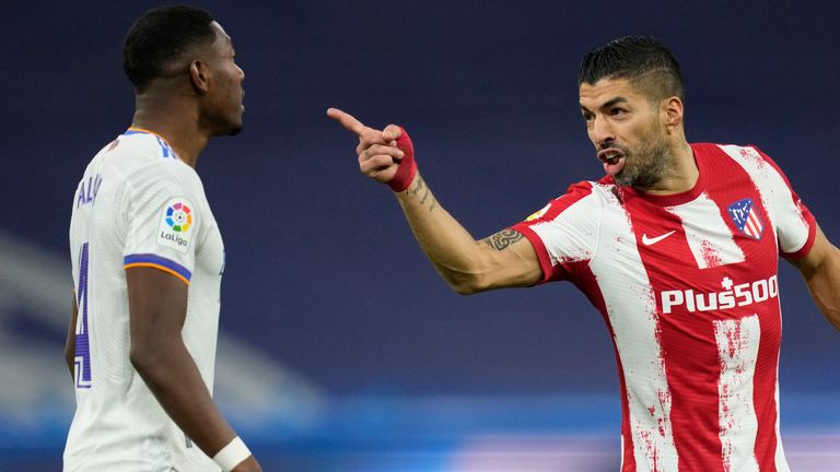 Luis Suarez confronts David Alaba during the Madrid derby