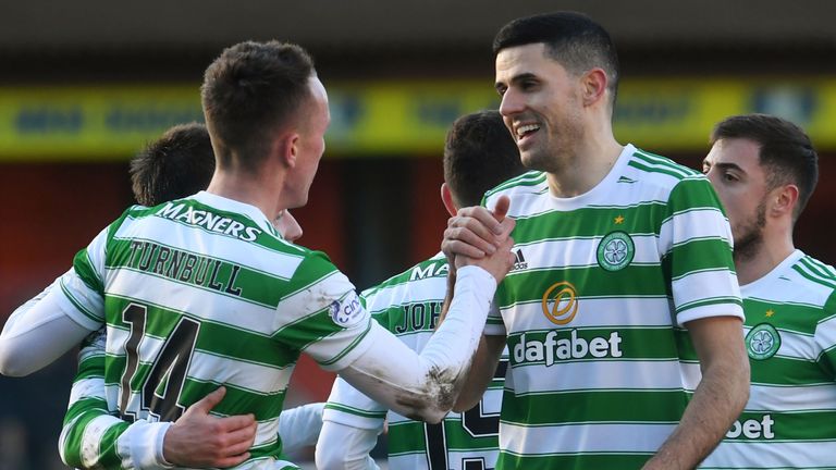 Celtic's David Turnbull celebrates making it 2-0 with Tom Rogic (right) vs Dundee United 