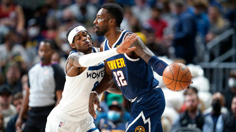 Denver Nuggets forward Jeff Green, right, looks for an outlet as Minnesota Timberwolves forward Jarred Vanderbilt defends in the first half of an NBA basketball game Wednesday, Dec. 15, 2021, in Denver. (AP Photo/David Zalubowski)