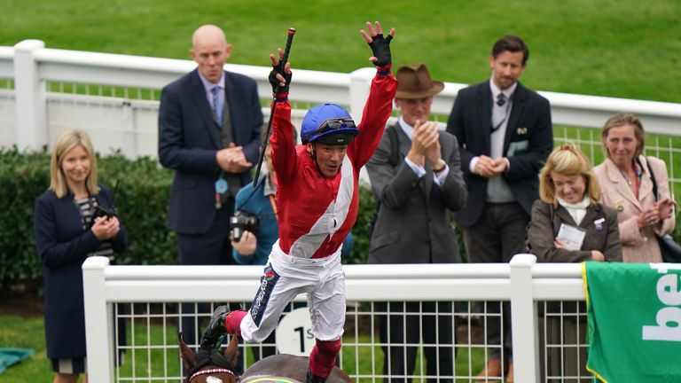 Dettori performs his signature flying dismount after victory on Inspiral
