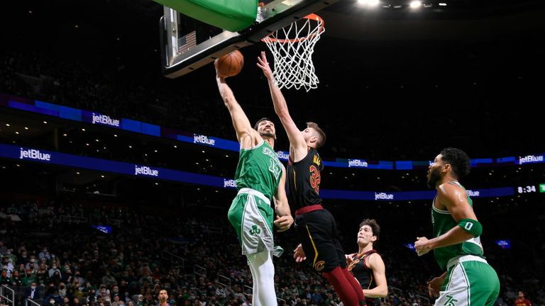 Enes Freedom #13 of the Boston Celtics drives to the basket during the game against the Cleveland Cavaliers on December 22, 2021 at the TD Garden in Boston, Massachusetts