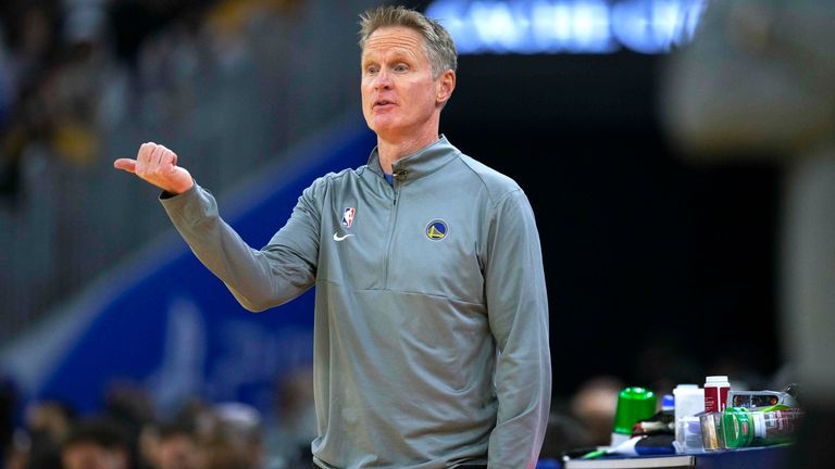 Golden State Warriors head coach Steve Kerr signals to his players