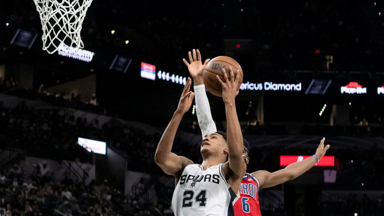 San Antonio Spurs&#39; Devin Vassell shoots against Detroit Pistons&#39; Hamidou Diallo