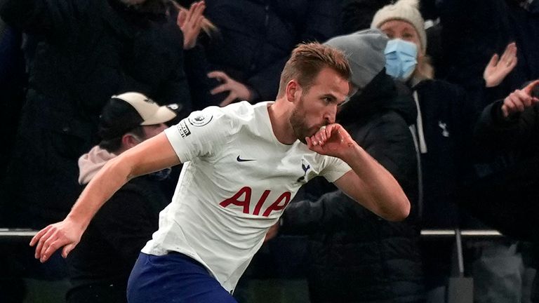 Tottenham's Harry Kane celebrates after scoring his side's opening goal during the English Premier League soccer match between Tottenham Hotspur and Liverpool