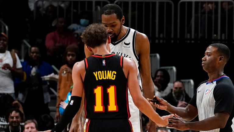Atlanta Hawks guard Trae Young and Brooklyn Nets forward Kevin Durant exchange words