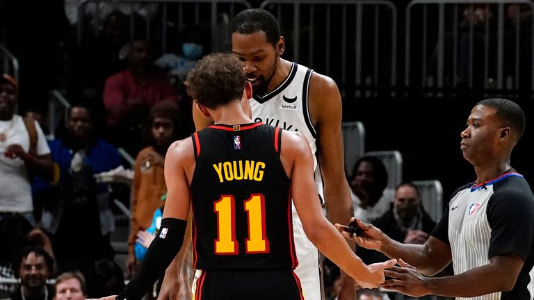 Atlanta Hawks guard Trae Young and Brooklyn Nets forward Kevin Durant exchange words