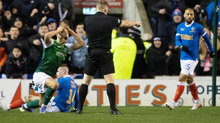EDINBURGH, SCOTLAND - DECEMBER 01: Referee John Beaton awards a penalty after a foul by Ryan Porteous on Rangers' Ryan Kent (right) during a Cinch Premiership match between Hibernian and Rangers at Easter Road, on December 01, 2021, in Edinburgh, Scotland.     (Photo by Craig Foy / SNS Group)