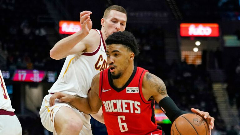 Houston Rockets&#39; Kenyon Martin Jr. (6) drives as Cleveland Cavaliers&#39; Dylan Windler (9) defends in the second half of an NBA basketball game, Wednesday, Dec. 15, 2021, in Cleveland. The Cavaliers won 124-89. (AP Photo/Tony Dejak)
