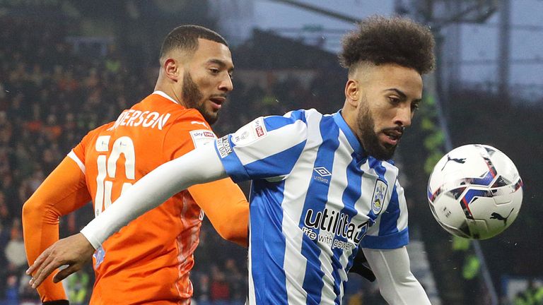  HUDDERSFIELD, ENGLAND - DECEMBER 26: Huddersfield Town's Sorba Thomas under pressure from Blackpool's Keshi Anderson during the Sky Bet Championship match between Huddersfield Town and Blackpool at Kirklees Stadium on December 26, 2021 in Huddersfield, England. (Photo by Rich Linley - CameraSport via Getty Images)                                                                                                                      