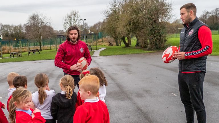 Iain Thornley delivers part of the Warriors Unite session to pupils at St Benedict's Primary School