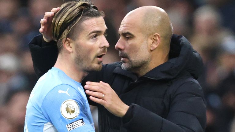 Manchester City's Jack Grealish greets manager Pep Guardiola after being substituted during the Premier League match at Manchester's Etihad Stadium.  Image date: Saturday December 11, 2021.