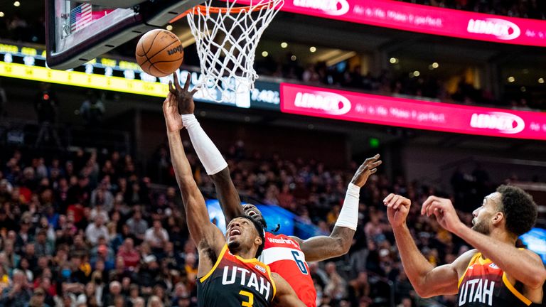 Utah Jazz guard Trent Forrest (3) and Washington Wizards center Montrezl Harrell (6) compete for a rebound in the first half during an NBA basketball game Saturday, Dec. 18, 2021, in Salt Lake City. (AP Photo/Isaac Hale)


