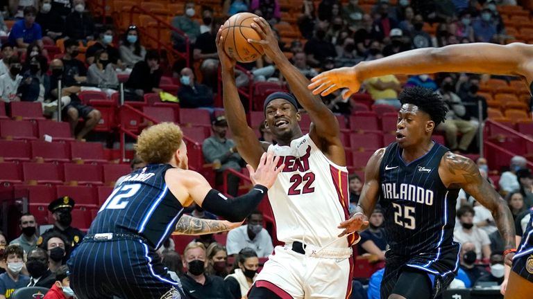 Miami Heat forward Jimmy Butler drives to the basket as Orlando Magic guard Hassani Gravett and forward Admiral Schofield defend