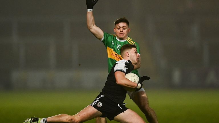 19 December 2021; Jerome Johnston of Kilcoo in action against Eunan Mulholland of Glen during the AIB Ulster GAA Football Club Senior Championship Semi-Final match between Glen and Kilcoo at Athletic Grounds in Armagh. Photo by David Fitzgerald/Sportsfile