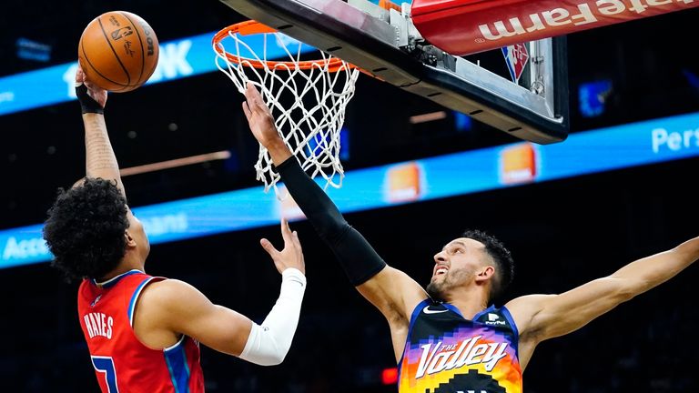 Detroit Pistons guard Killian Hayes shoots over Phoenix Suns guard Landry Shamet