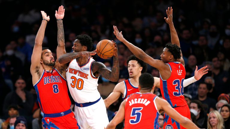 New York Knicks forward Julius Randle (30) looks for help as Detroit Pistons&#39; Trey Lyles (8), Cade Cunningham, Frank Jackson (5) and Saben Lee (38) defend during the first half of an NBA basketball game Tuesday, Dec. 21, 2021, in New York. (AP Photo/Noah K. Murray)


